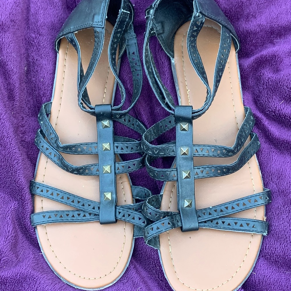 Black flat sandals with gold studs